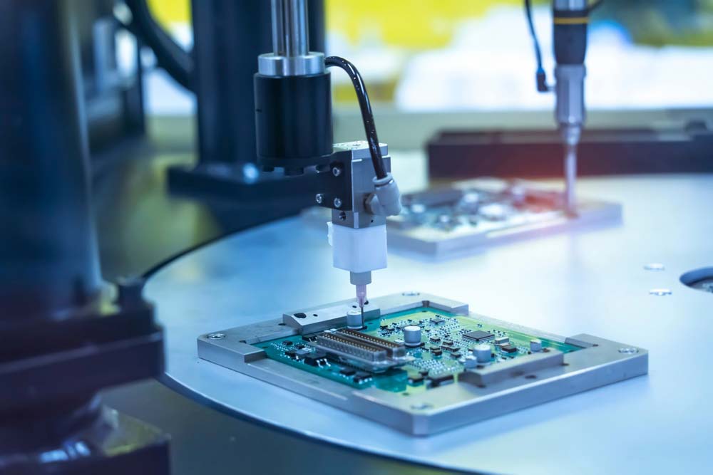 robot holding glue syringe injection on PCB
