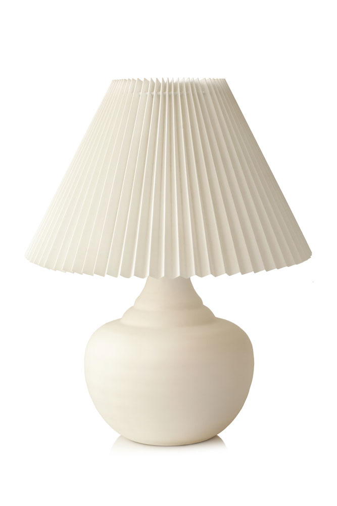 Woman Fixing Lamp