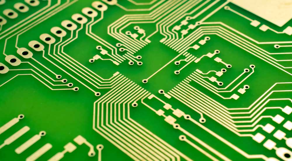 An unassembled circuit board with a layout of copper tracks